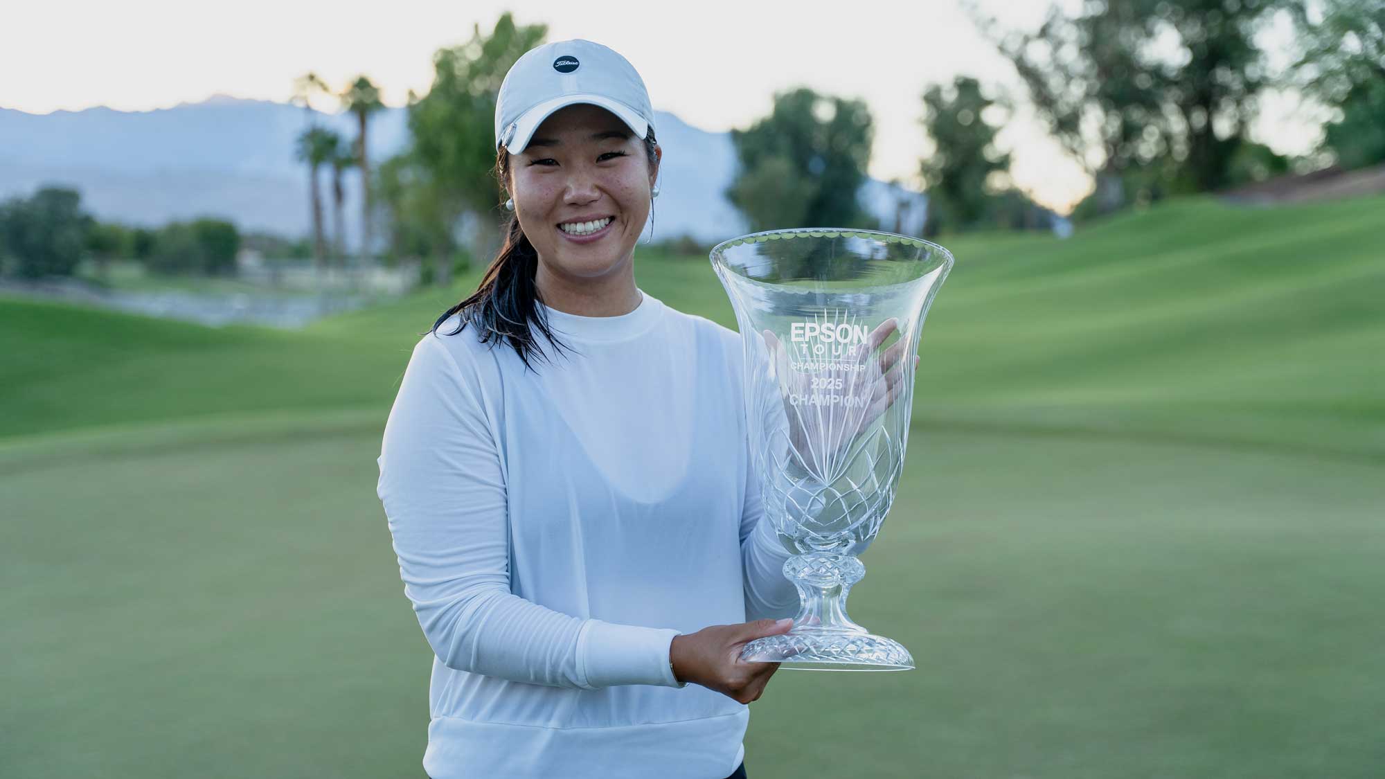 Anne Chen poses with the Epson Tour Championship trophy.