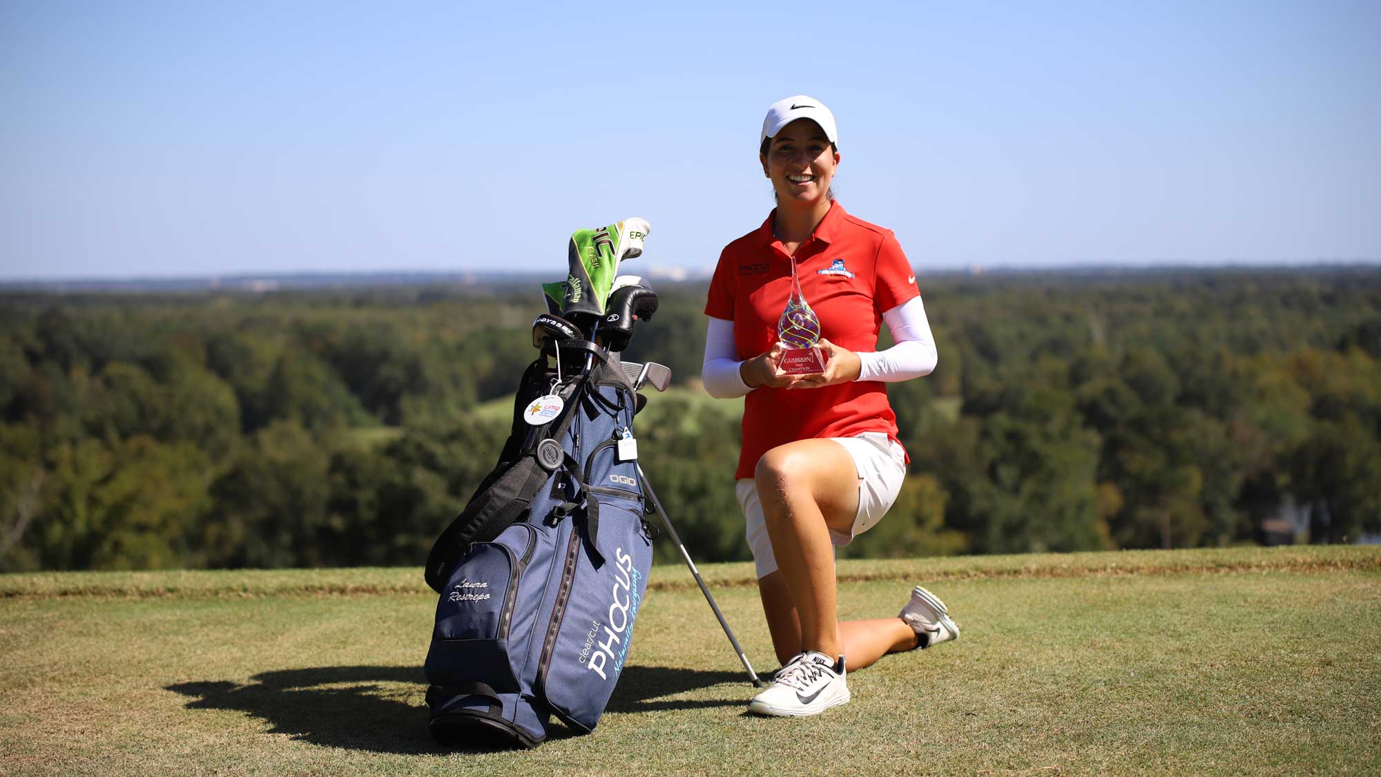 Laura Restrepo with trophy and bag